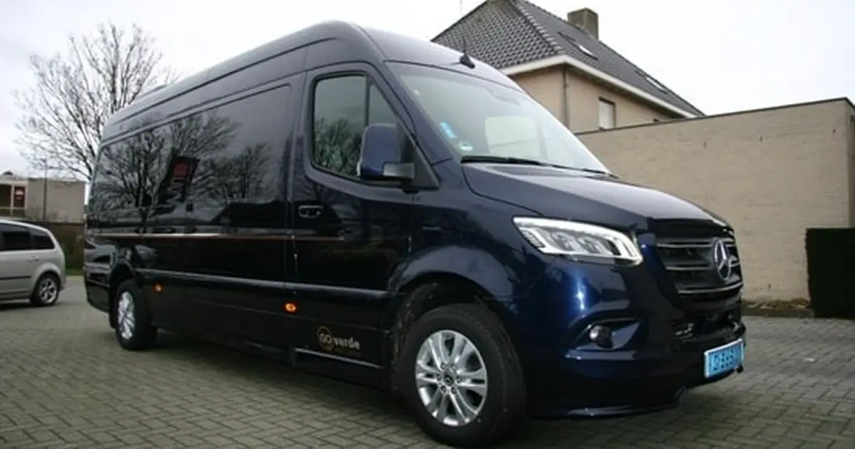 A 16 seater minibus Mercedes Sprinter at the street in Breda