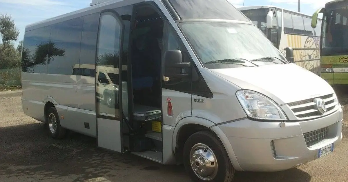 A 19 seater minibus Tommasini Sprinter parked in Florence