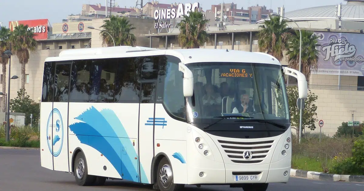 A 20 seater Mercedes midibus with driver on the streets in Alicante