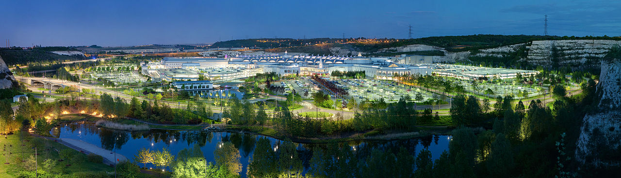 A panoramic view of Bluewater Shopping Centre at dusk